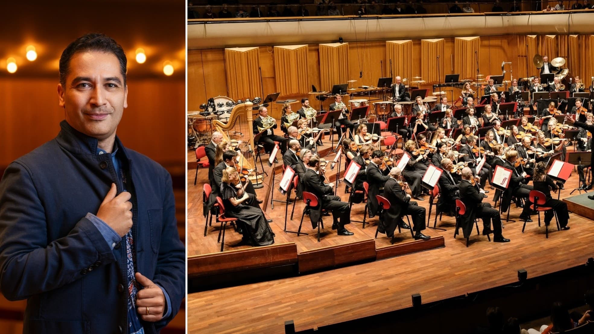 En person i kostym står framför en stor symfoniorkester som spelar på en välbelyst scen i en konsertsal med träpaneler.